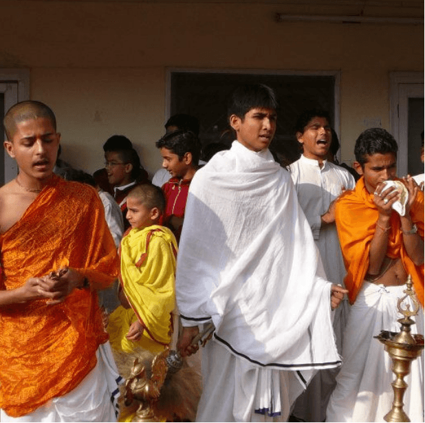 Ceremonial morning at the scholastic monastery in India